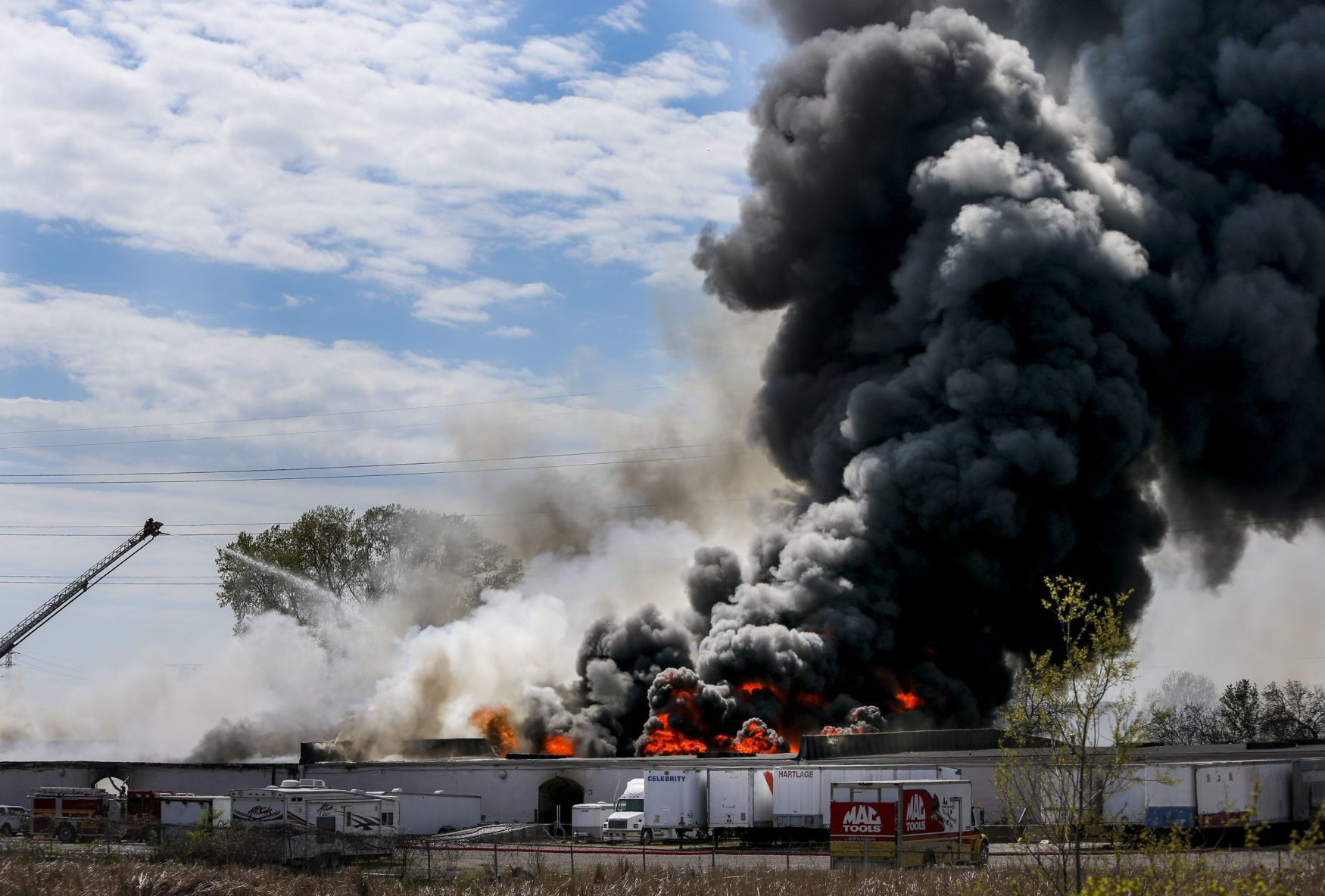 Large fire rolls through warehouse
